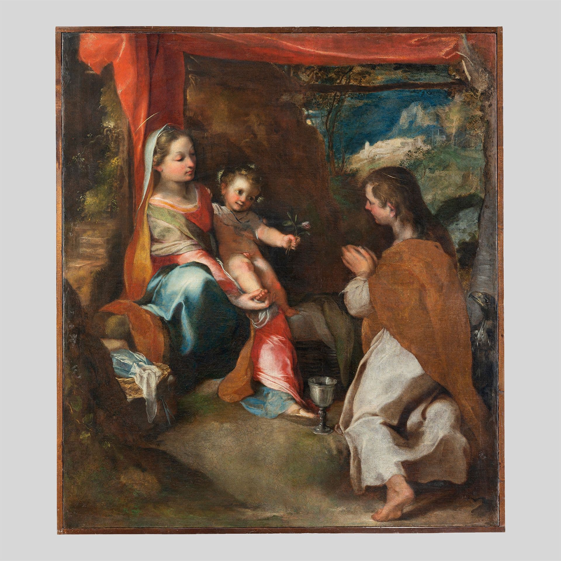Dipinto a olio raffigurante la Vergine Maria seduta con il Bambino Gesù in grembo che porge un fiore a una santa inginocchiata in adorazione; in primo piano un calice, sullo sfondo un paesaggio con borgo collinare